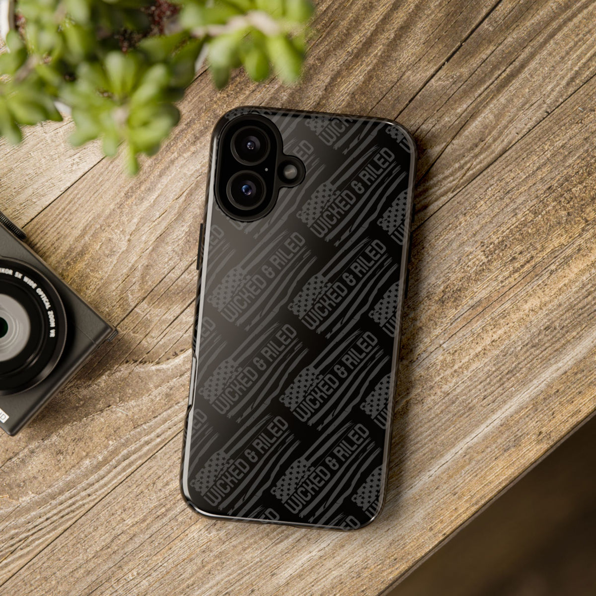 Rugged black protective phone case with "TOUGH CASES" text pattern by Printify, showcasing tough exterior and design.