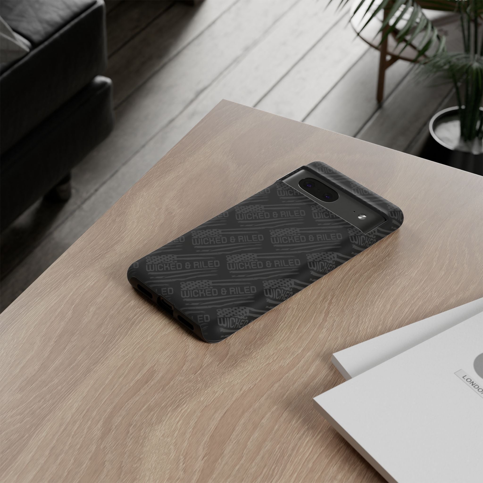 Rugged black protective phone case with "TOUGH CASES" text pattern by Printify, showcasing durable design and texture.