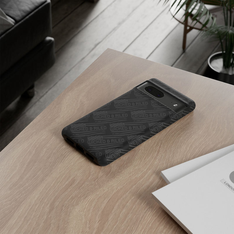 Rugged black protective phone case with "TOUGH CASES" text pattern by Printify, showcasing durable design and texture.