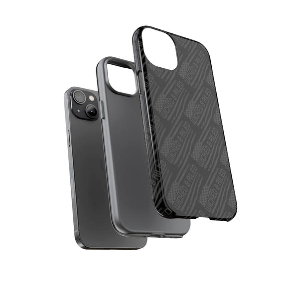 Rugged black protective phone case with "TOUGH CASES" text pattern by Printify, showcasing durable design and texture.