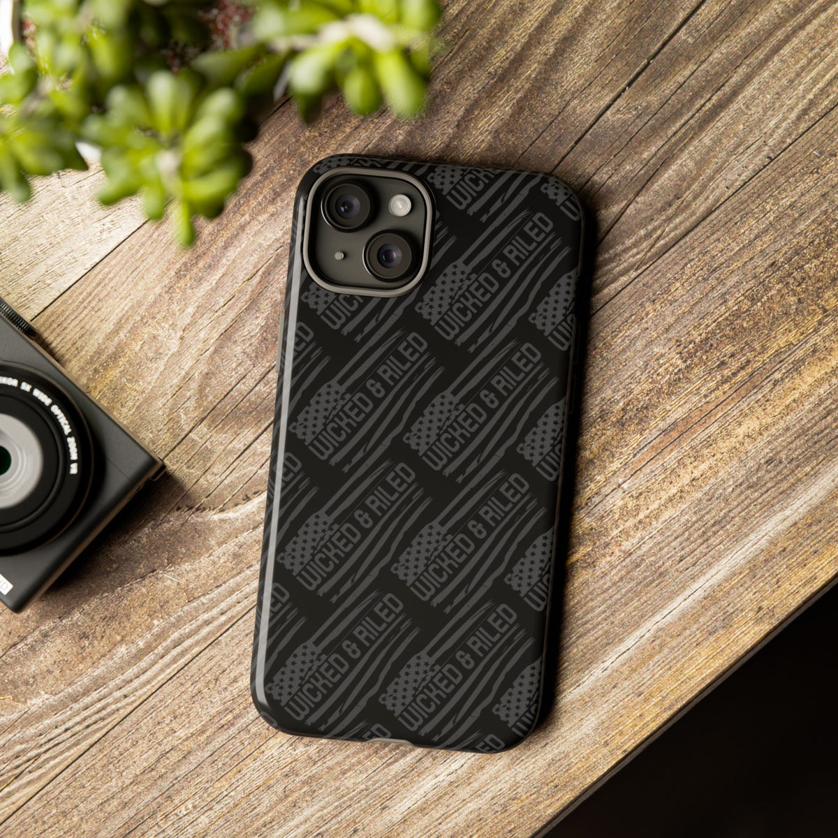 Rugged black protective phone case by Printify featuring a textured "TOUGH CASES" pattern.