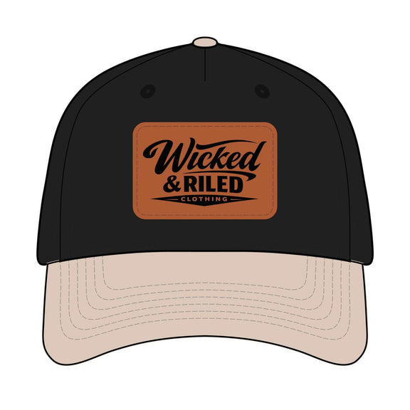 Wicked & Riled leather patch baseball cap featuring a distressed American flag logo on a dark background.