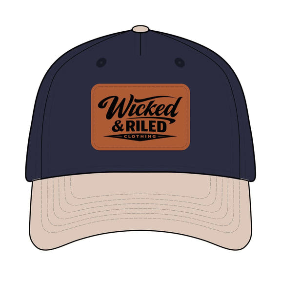 Wicked & Riled leather patch baseball cap featuring a distressed American flag logo on a classic hat design.