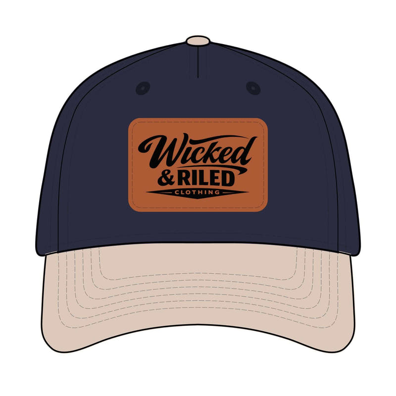 Wicked & Riled leather patch baseball cap featuring a distressed American flag logo on a classic hat design.