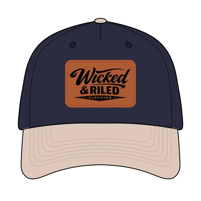 Wicked & Riled leather patch baseball cap featuring a distressed American flag logo on a classic hat design.