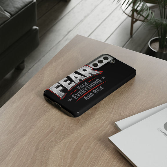 Fear Phone Case by Printify featuring a motivational design with "Face Everything and Rise" text on a sleek surface.