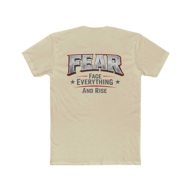 White FEAR Face Everything And Rise T-Shirt by Printify displayed on a hanger against a neutral background.