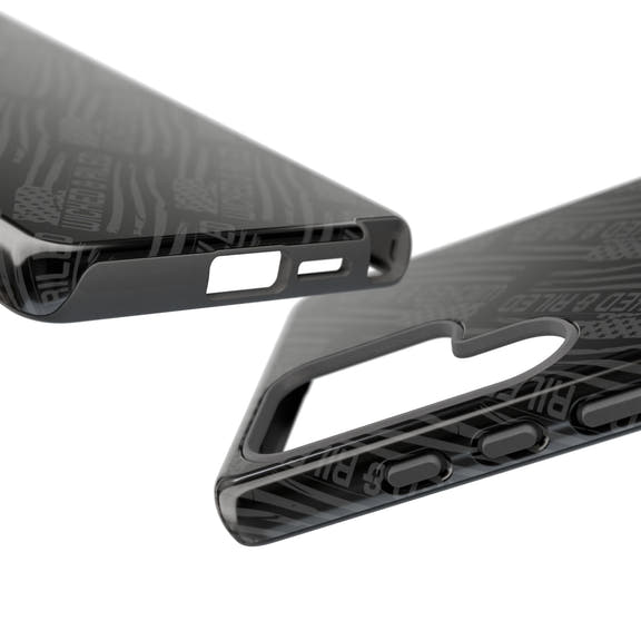 Rugged black protective phone case by Printify with a "TOUGH CASES" text pattern on a textured surface.