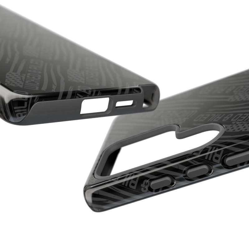 Rugged black protective phone case by Printify with a "TOUGH CASES" text pattern on a textured surface.