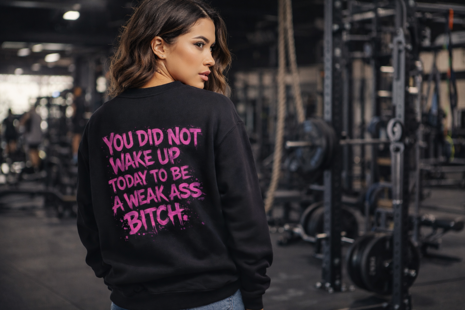 White crewneck sweatshirt with distressed flag and bold pink spray-paint slogan "You did not wake up today to be a weak ass bitch"