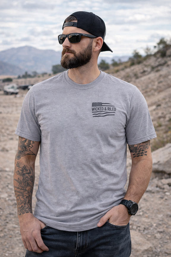 Bold graphic design on a Wicked & Riled T-Shirt by Printify, featuring a simple flag motif on a casual tee.