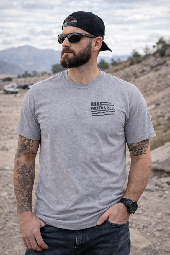 Bold graphic design on a Wicked & Riled T-Shirt by Printify, featuring a simple flag motif on a casual tee.