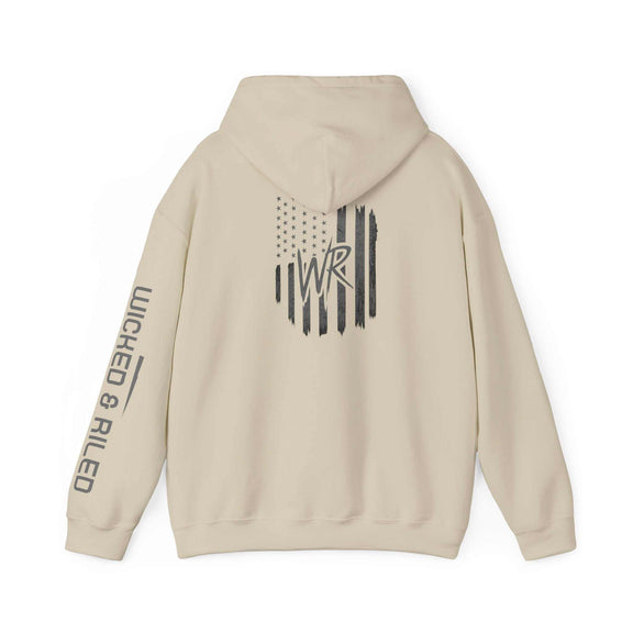 Wicked & Riled flag hoodie featuring a distressed American logo pullover design in a casual setting.