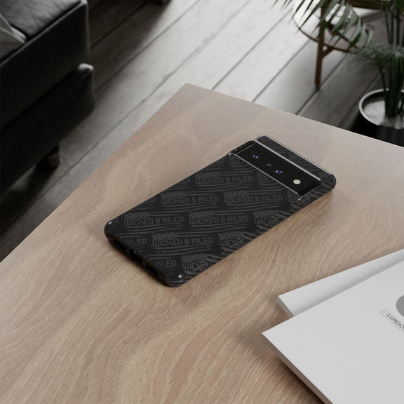 Rugged black protective phone case by Printify featuring a textured 'TOUGH CASES' pattern for enhanced grip and durability.