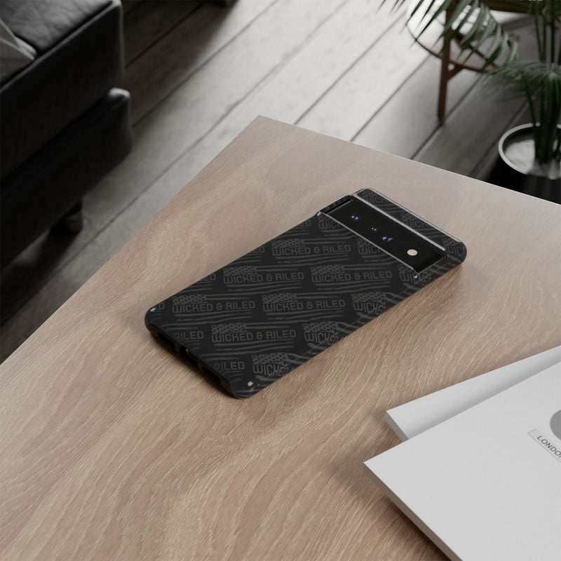 Rugged black protective phone case by Printify featuring a textured 'TOUGH CASES' pattern for enhanced grip and durability.